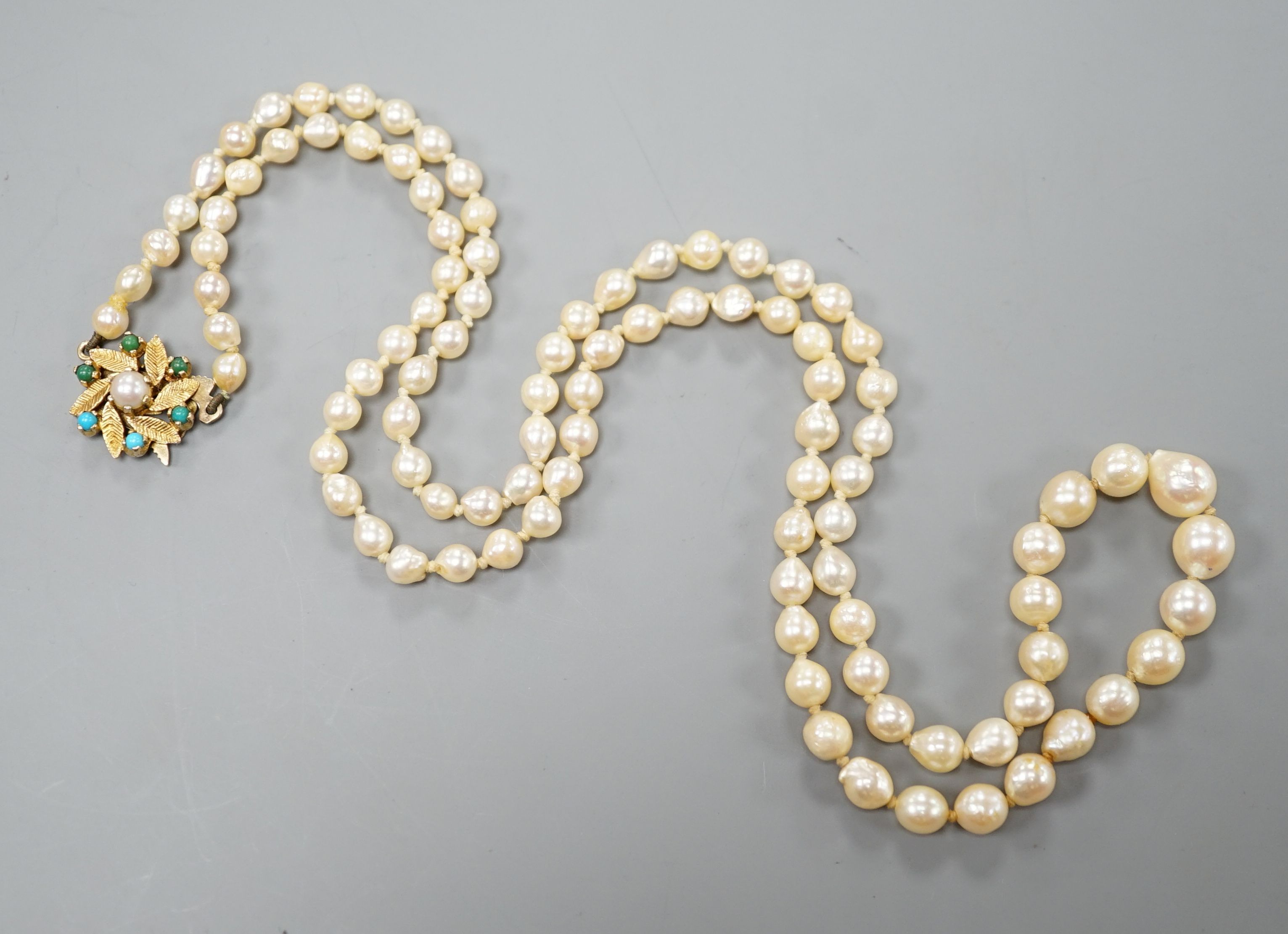 A single strand cultured pearl necklace with turquoise set 9ct gold clasp, 60cm